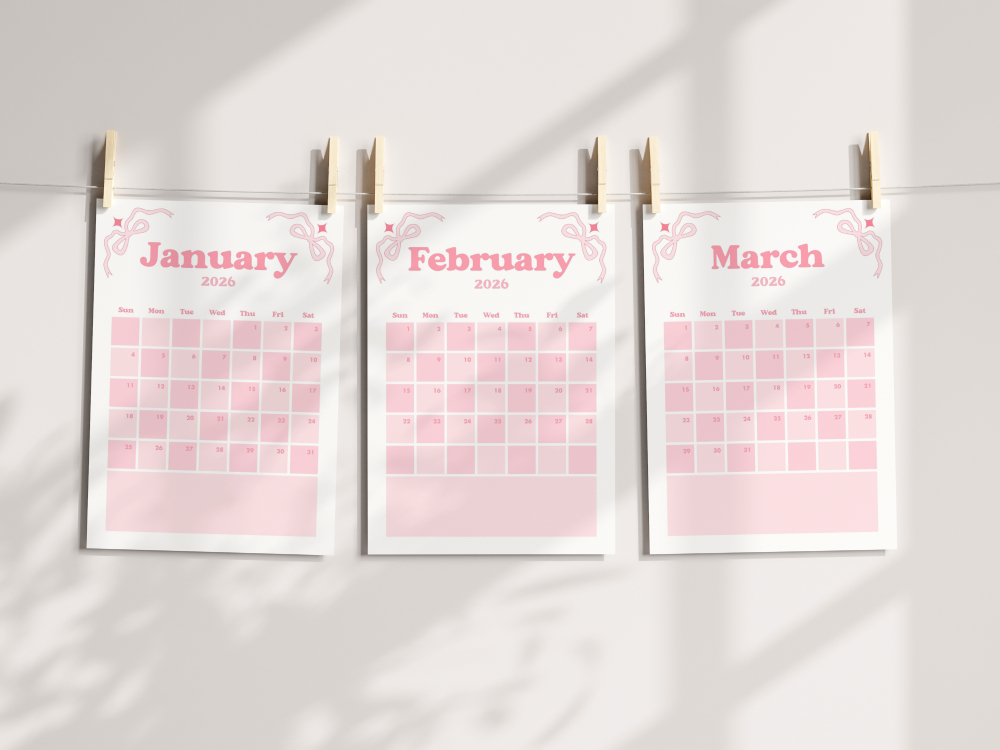 Three A4 pink 2026 coquette calendar pages for January, February, and March. These calendar pages hang on a string with wooden pegs.