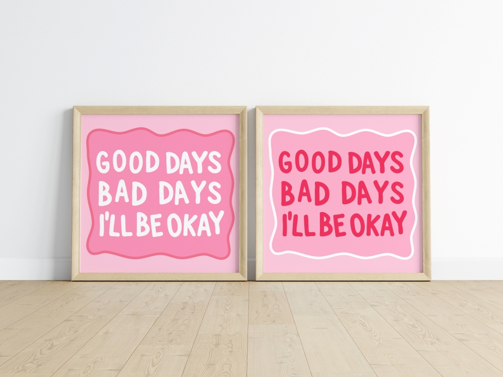 A mockup of two framed art prints featuring the trendy phrase 'Good Luck Girl' in bold pink text, decorated with four-leaf clovers.