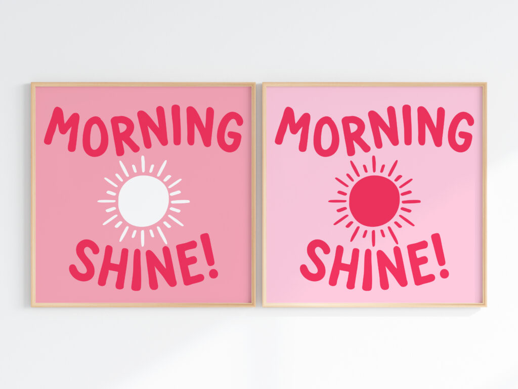 A mockup of two framed art prints with the cheerful quote 'Morning Shine!' and a drawing of a sun. The left version has a pink background with a white sun, while the right version has a light pink background with a red sun.
