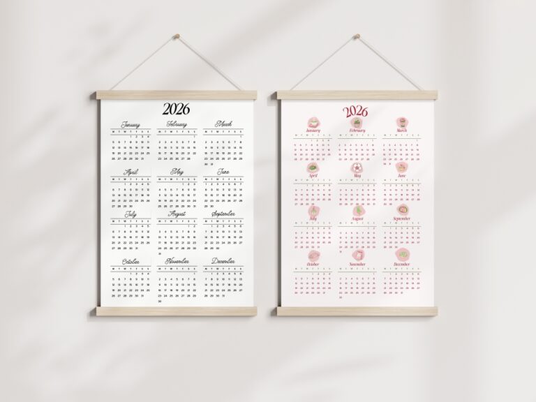 A mockup showing two 2026 calendars hanging side-by-side on a wall in wooden frames. The left calendar is black and white, and the right calendar is a pink matcha theme