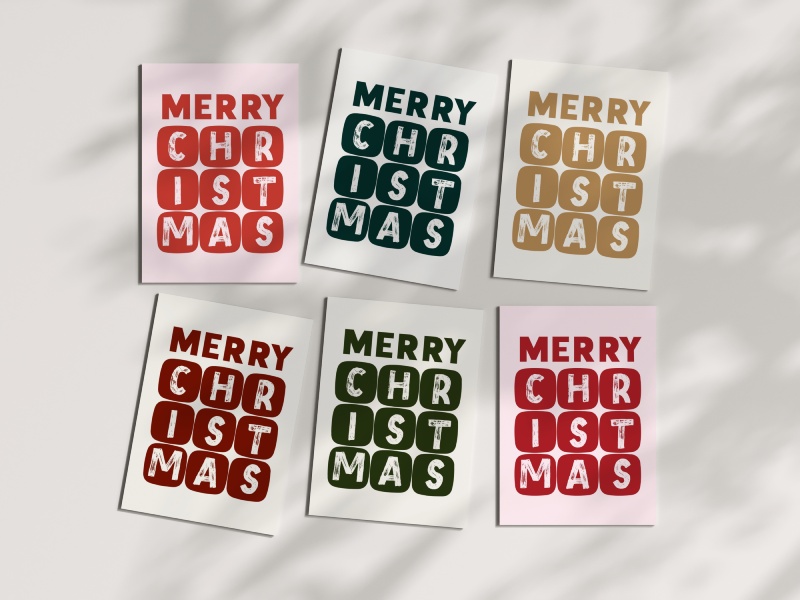 Block-style Christmas cards with bold lettering and distressed textures in festive colours.