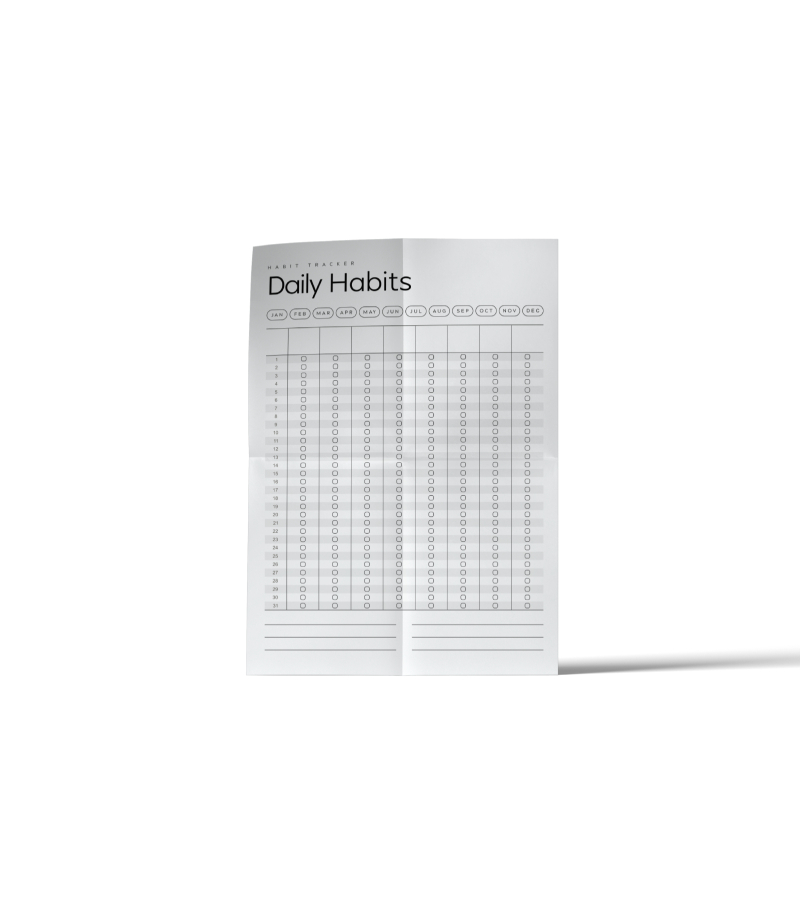 A folded printable daily habit tracker with month tabs across the top and a checkbox grid for days 1 to 31.